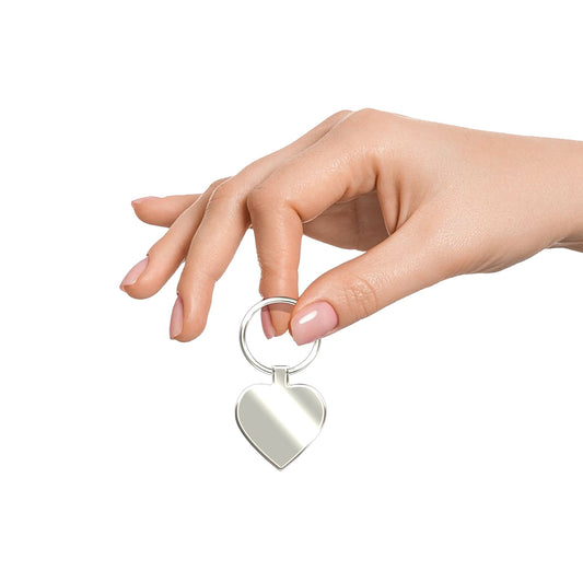 Charming silver heart keychain held in hand – Custom engraved and shown at real size for a personal keepsake