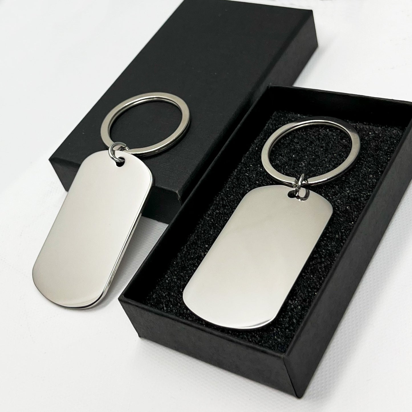 Custom silver oval keychain in a luxurious black gift box – A memorable engraved treasure
