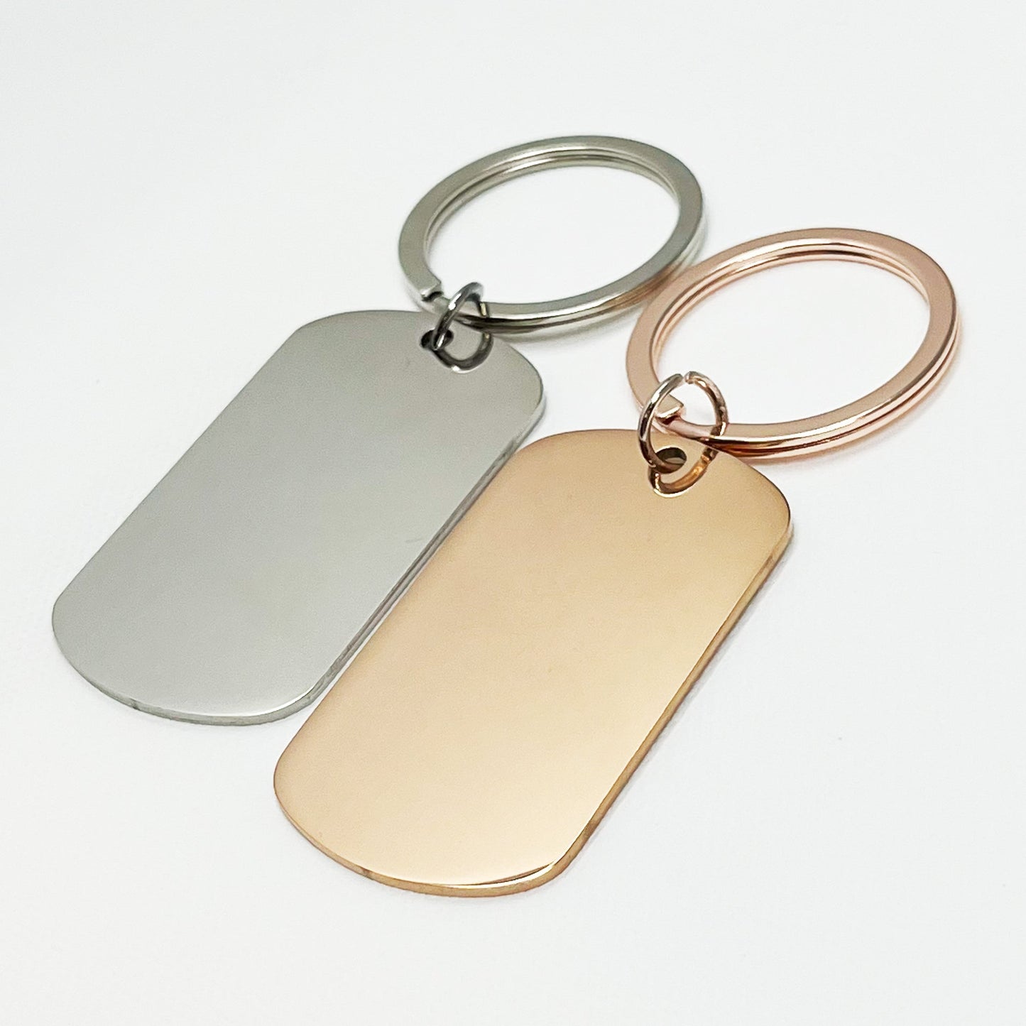 Stylish silver and rose gold oval keychains in a modern black gift box – Custom engraved keepsakes