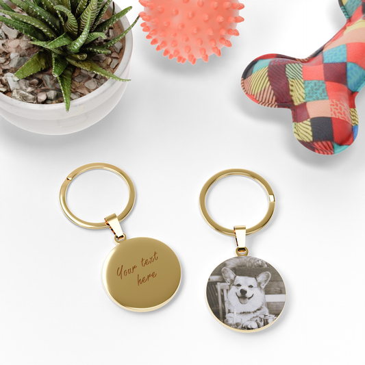 Personalised round keychain for pet lovers with custom pet name and paw print engraving