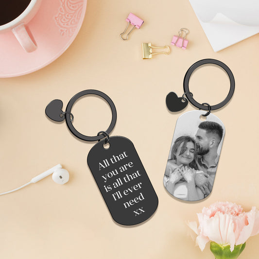 Stylish oval black keychain with a decorative heart accent, couple design, and personalised text – A meaningful keepsake